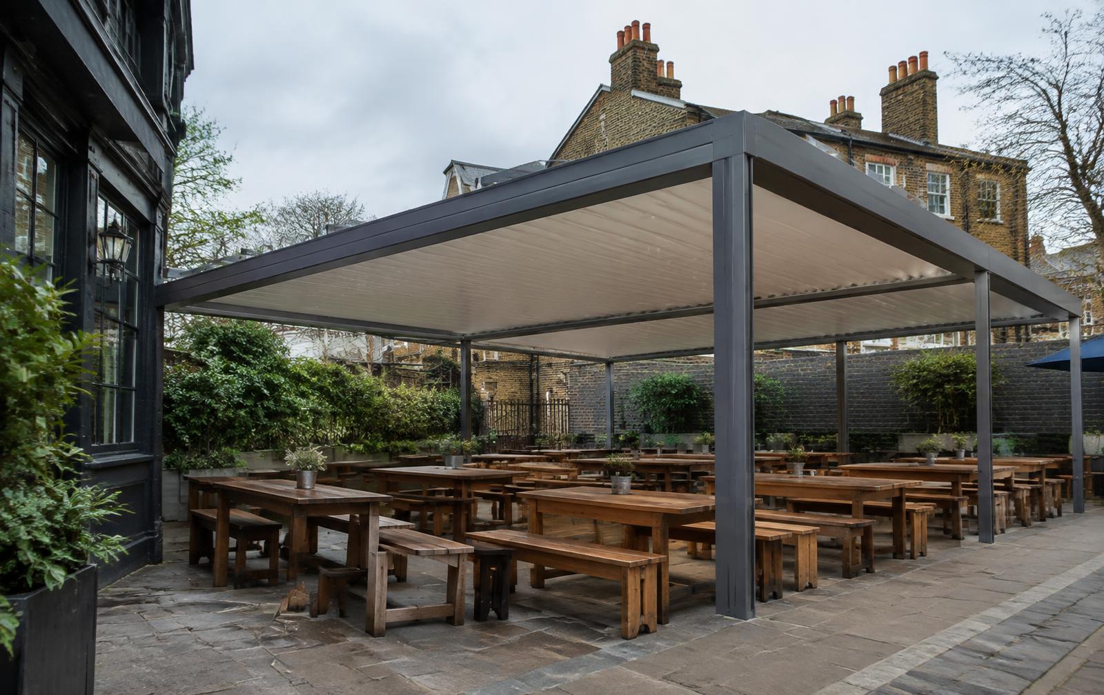Freestanding commercial canopy over a London pub beer garden